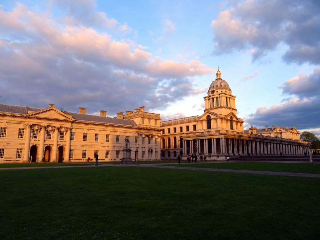 View of the Grand Greenwich architecture illuminated by sunset light with a dramatic sky. Best UK universities.